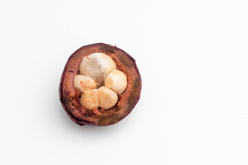Isolated tropical fruits. One whole mangosteen isolated on white with clipping path.