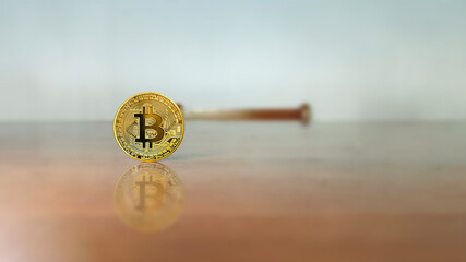 Bitcoin gold coin and defocused chart background. Business man with bitcoins. Virtual cryptocurrency concept.