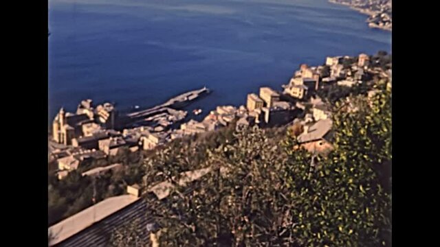panorama of city port of Portofino and Camogli from via Aurelia road with Dragonara castle. Archival of Italy in 1980s of Rapallo city in Liguria region of Italy in 1987.