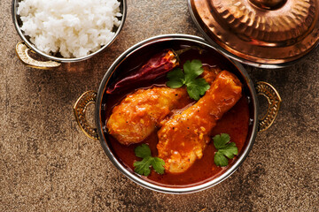 Indian dish Spicy Chicken Curry. Spicy chicken legs with rice. Top view