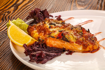 Baked salmon steak with cheese