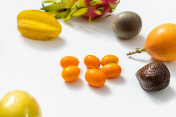 Mix of different fruits and berries isolated on white background, flat lay, top view.