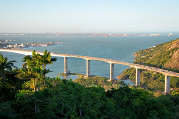 Fototapeta premium aerial view of the bridge over the sea and tropical trees