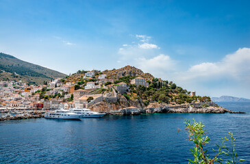 Fototapeta premium View of the entrance of the port of Hydra, seen from Miaoulis' monument. Hydra is a small picturesque island in Saronic gulf and a popular tourist destination.
