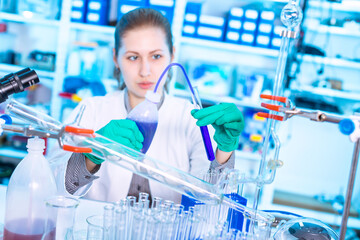 Young woman in a pharmacological laboratory. Antiallergic drug development and research