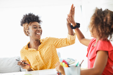 homework teaching girl high five education mother children daughter familiy childhood success child...