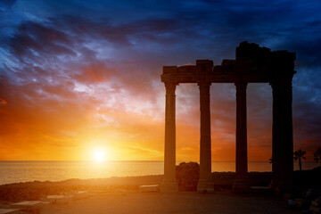 Architectural columns from the times of ancient greece. Ruins against the sunset sky. Side turkey