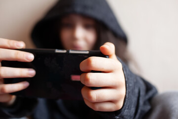 Little girl looking at her phone screen