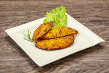 Baked potato with herbs and spices