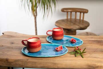 colorful handmade ceramic coffee mug on white