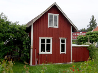 A small red house in a Swedish village.