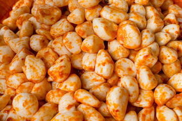 bowl of fresh peeled garlic with tomato and chilli sauce