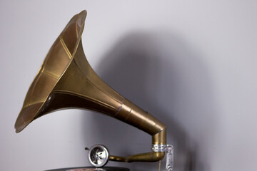 Old gramophone with a plate record. Portable wind-up gramophone. Patephone