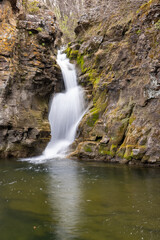Fototapeta na wymiar Red Rock Falls In The Spring