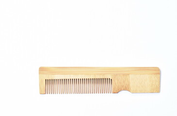 wooden comb for environment arranging isolated on white background