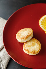 Cheesecakes with orange zest. Delicious healthy cottage cheese breakfast
