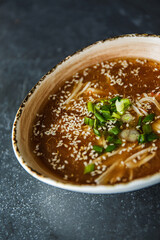 Delicious Asian soup with vegetables, 
cilantro and peanut sauce. Healthy lunch	
