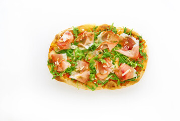 Pizza with prosciutto (parma ham), arugula (salad rocket) and parmesan on white background top view. Fast food, copy space