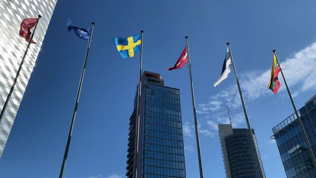 Lithuanian, Estonian, Latvian , Swedish, EU flags and flag of Vilnius waving in business city center of Vilnius