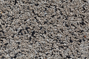 Crushed granite stones wall - close up