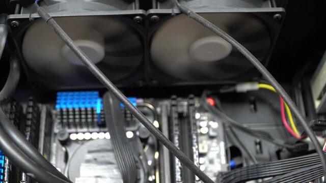 Water cooling CPU system with two 120mm fans in PC case. Water cooling is provide stability and performance for power CPU with high TDP. Video about modern PC.