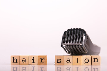 Electric shaver with lettering Hair salon and white background: equipment for free home haircut