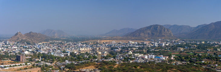 Fototapeta na wymiar Panorama view of Pushkar city and lake in the Ajmer district in the Indian state of Rajasthan.