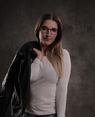 Photo shooting with a young attractive woman in a studio - studio photography