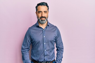 Middle age man with beard and grey hair wearing business clothes with a happy and cool smile on face. lucky person.