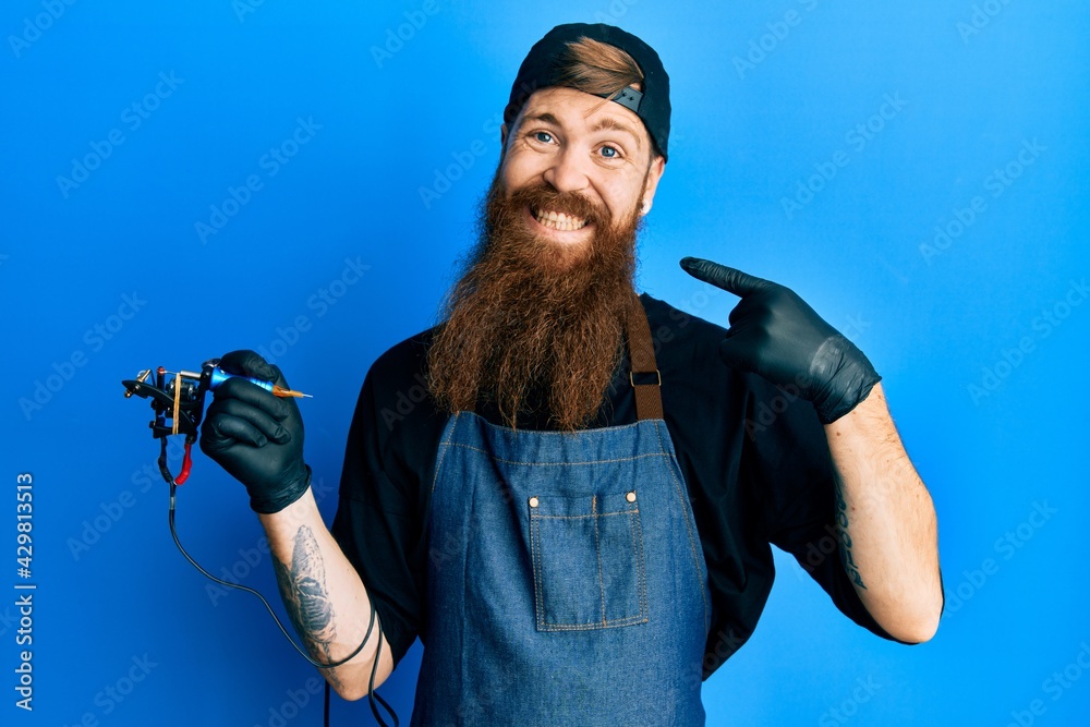 Canvas Prints redhead man with long beard tattoo artist wearing professional uniform and gloves smiling cheerful s