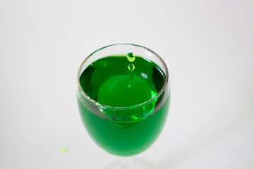 Glass with Green Liquid