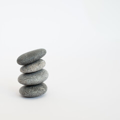 Pile of four stones with white background
