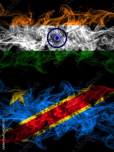 India, Indian vs Democratic Republic of the Congo smoky mystic flags placed side by side. Thick colored silky abstract smoke flags.