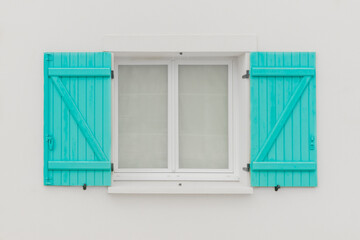 Window with turquoise shutters
