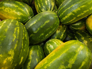 Pile of farm fresh ripe watermelons.