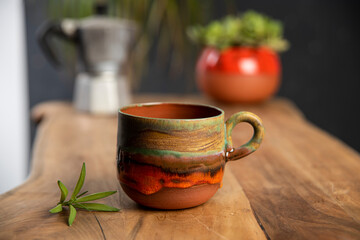 cup of coffee on wooden table in the morning