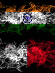 India, Indian vs Malta, Maltese smoky mystic flags placed side by side. Thick colored silky abstract smoke flags.