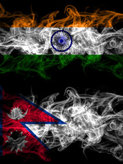 India, Indian vs Nepal, Nepali, Nepalese smoky mystic flags placed side by side. Thick colored silky abstract smoke flags.