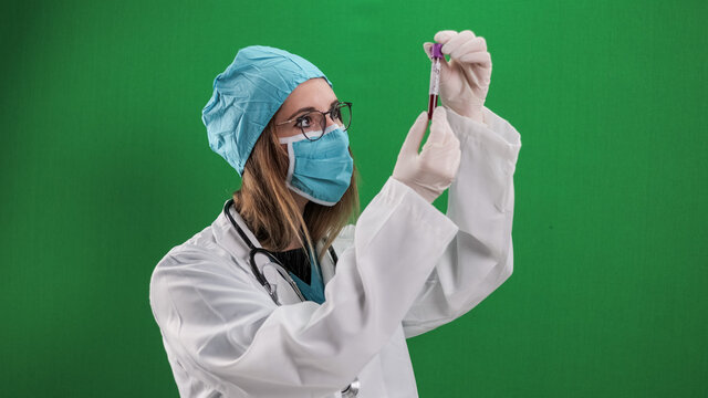 Female doctor examines a blood sample - studio photography