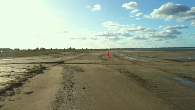 Flying a drone behind Blokarts along the shore. France. High quality FullHD footage