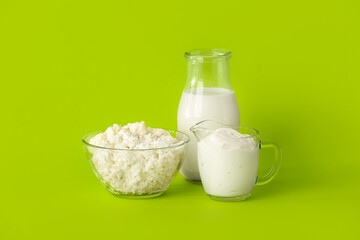 Different dairy products on color background