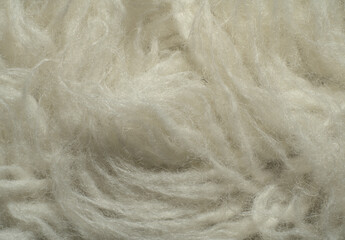 White faux fur texture. With a long coat. Closeup