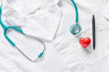 Modern stethoscope with heart and pen on doctor's uniform