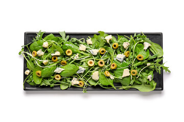 Plate of tasty salad with olives on white background