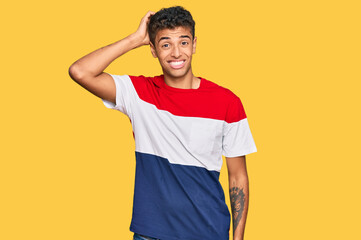 Young handsome african american man wearing casual clothes confuse and wonder about question....