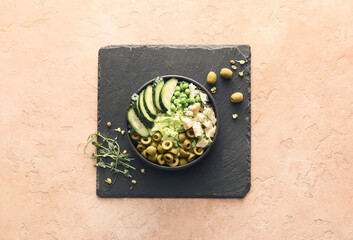 Bowl of tasty salad with fresh vegetables on color background