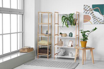 Modern book shelves with decor in interior of room