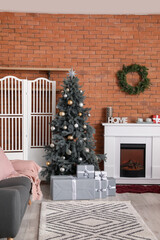 Interior of room with Christmas tree and fireplace