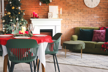 Interior of dining room with Christmas tree and fireplace