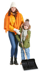 Woman and her little daughter with shovel for removing snow on white background